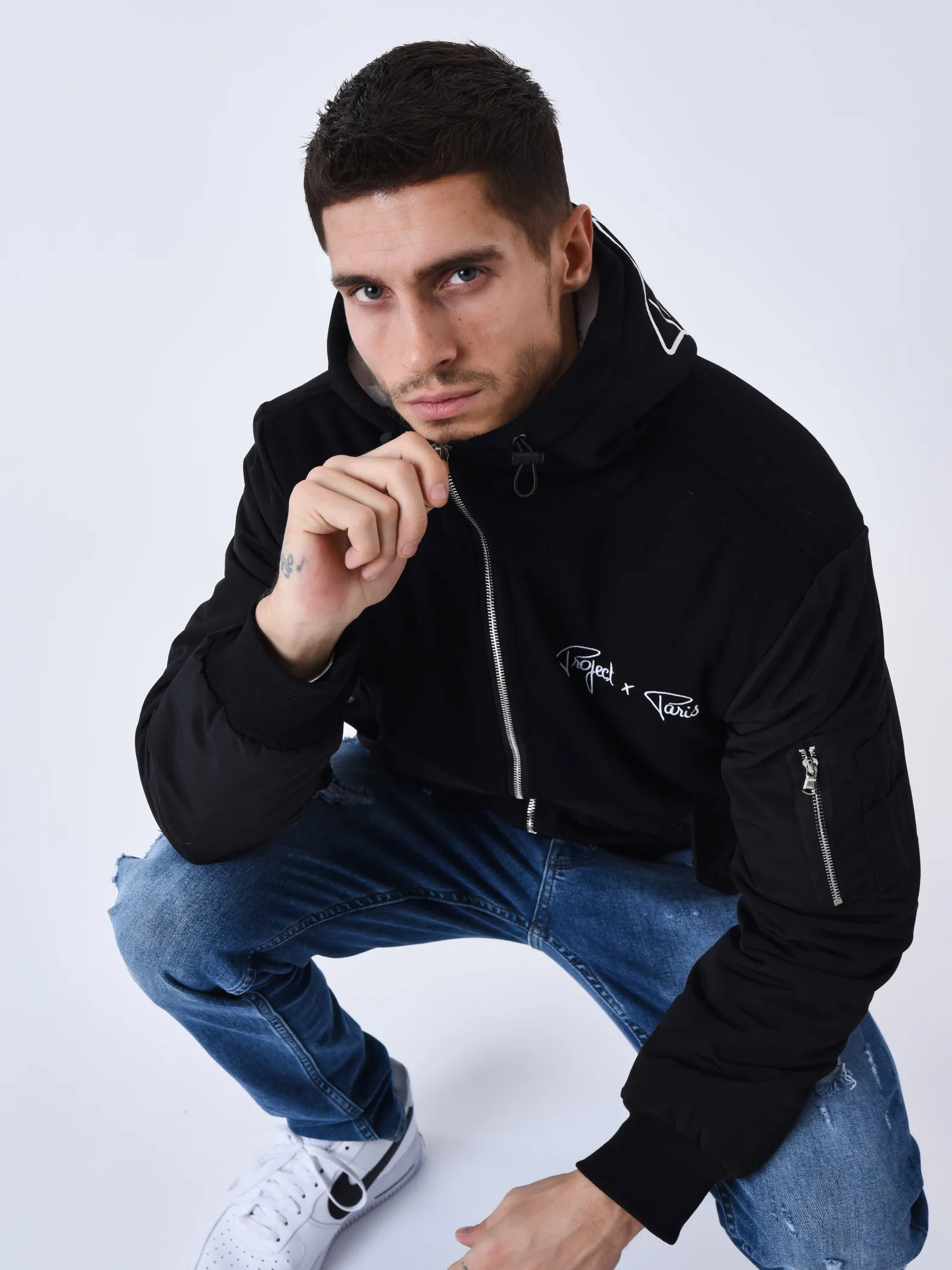 Chaqueta bimaterial con capucha y forro polar