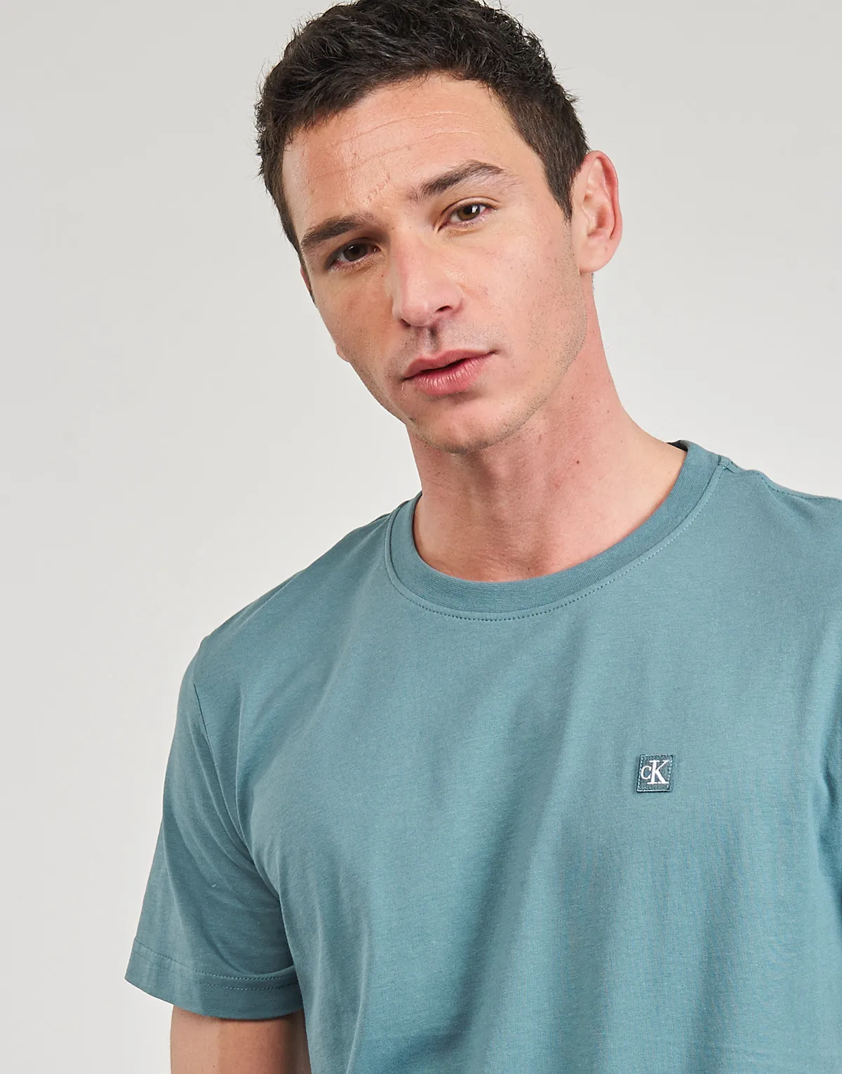 CK EMBRO BADGE TEE