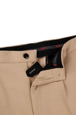 Pantalones de corte moderno en punto elástico técnico