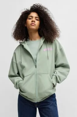 Sudadera con capucha y cremallera en felpa de algodón con estampado de temporada