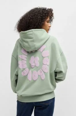 Sudadera con capucha y cremallera en felpa de algodón con estampado de temporada